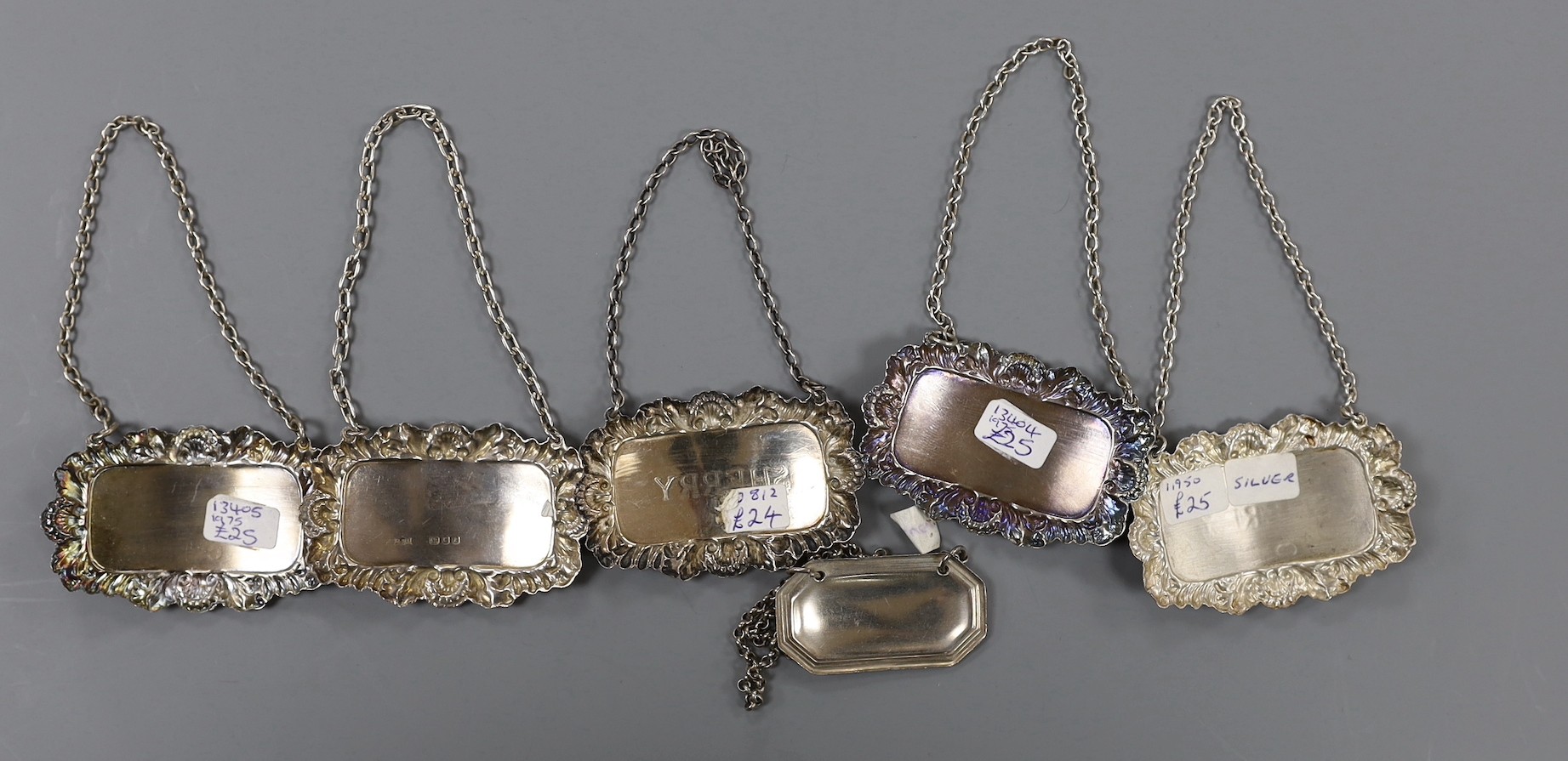 A modern pair of silver 'Sherry' & 'Madeira' wine labels, three other silver 'Sherry' wine labels and a plated wine label.
